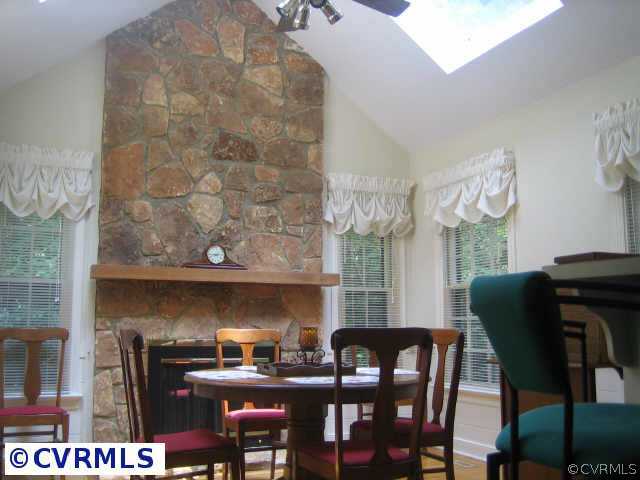 3208 Fortunes Ridge Road Midlothian, VA 23112 - Photo 10 of 10 a view of a dining room with furniture and chandelier