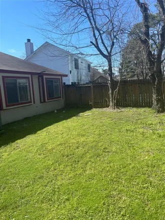 a backyard of a house with lots of green space