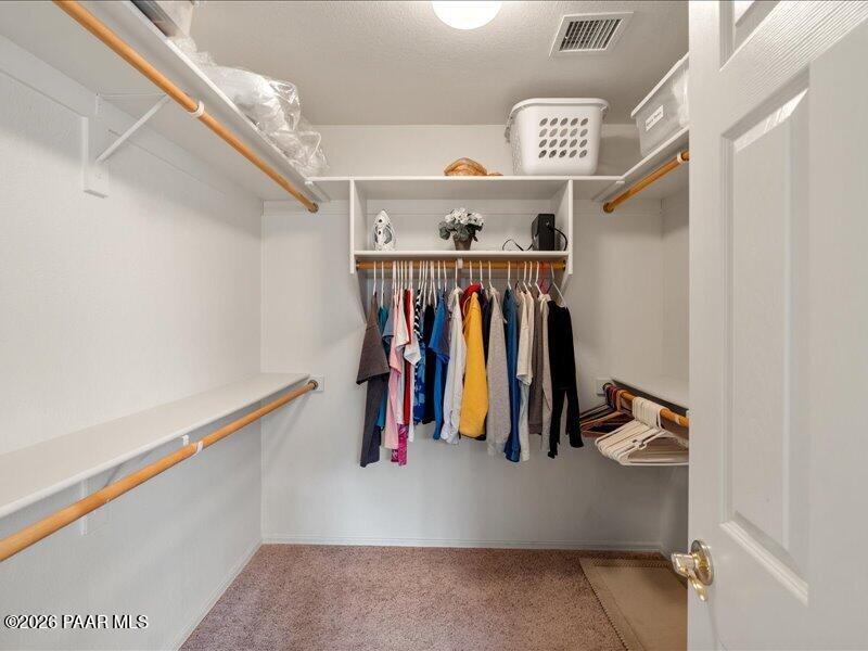 2415 Sherry Paulden, AZ 86334 - Photo 21 of 41 a view of walk in closet with clothes and shoes
