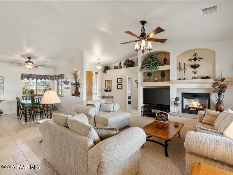 2415 Sherry Paulden, AZ 86334 - Photo 9 of 41 a living room with furniture a fireplace and a flat screen tv