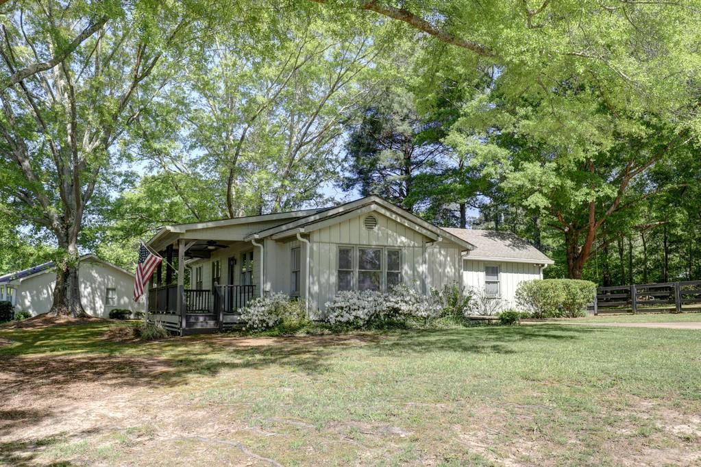 a front view of a house with garden