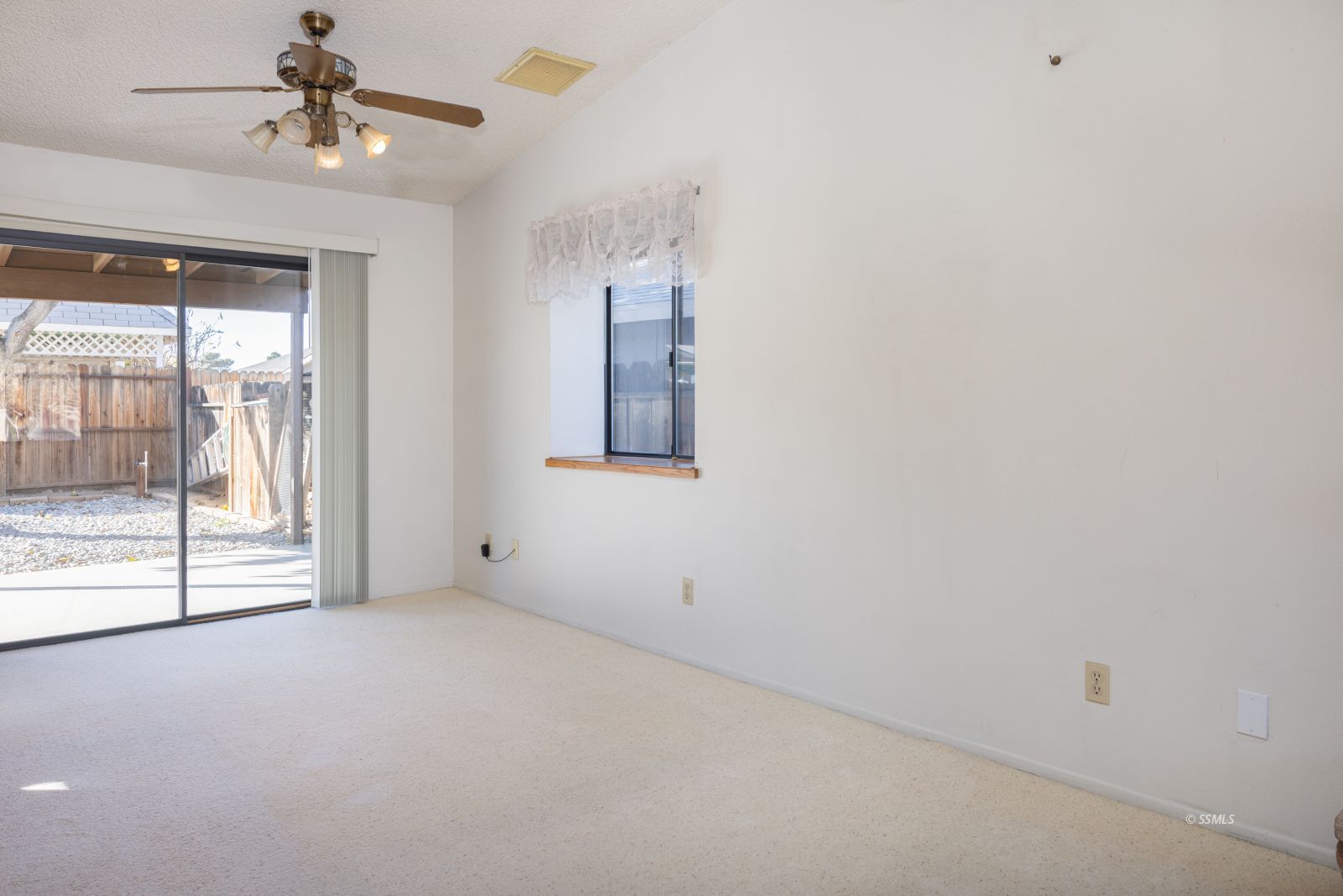135 Chambers Street Ridgecrest, CA 93555 - Photo 8 of 26 a view of an empty room with a window