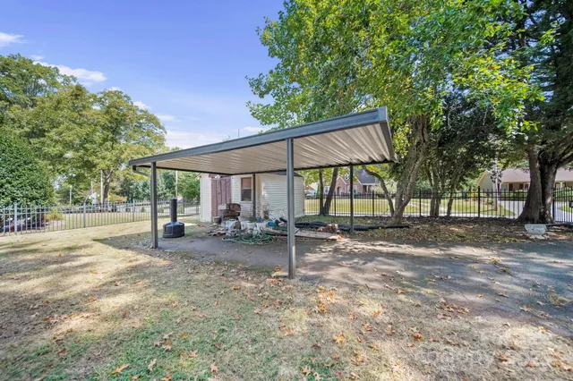 a view of a house with backyard porch and sitting area