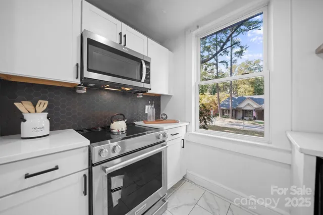a kitchen with a stove and a microwave