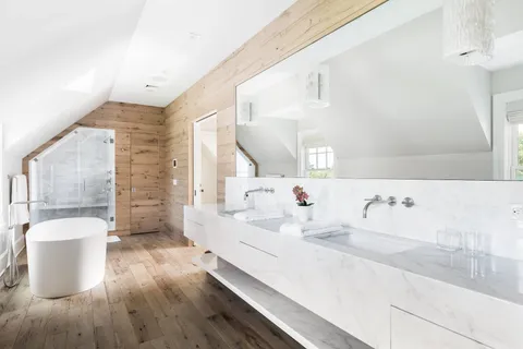 a en suite bathroom with a bathtub and a sink