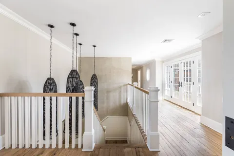 a view of a living room and hardwood floor