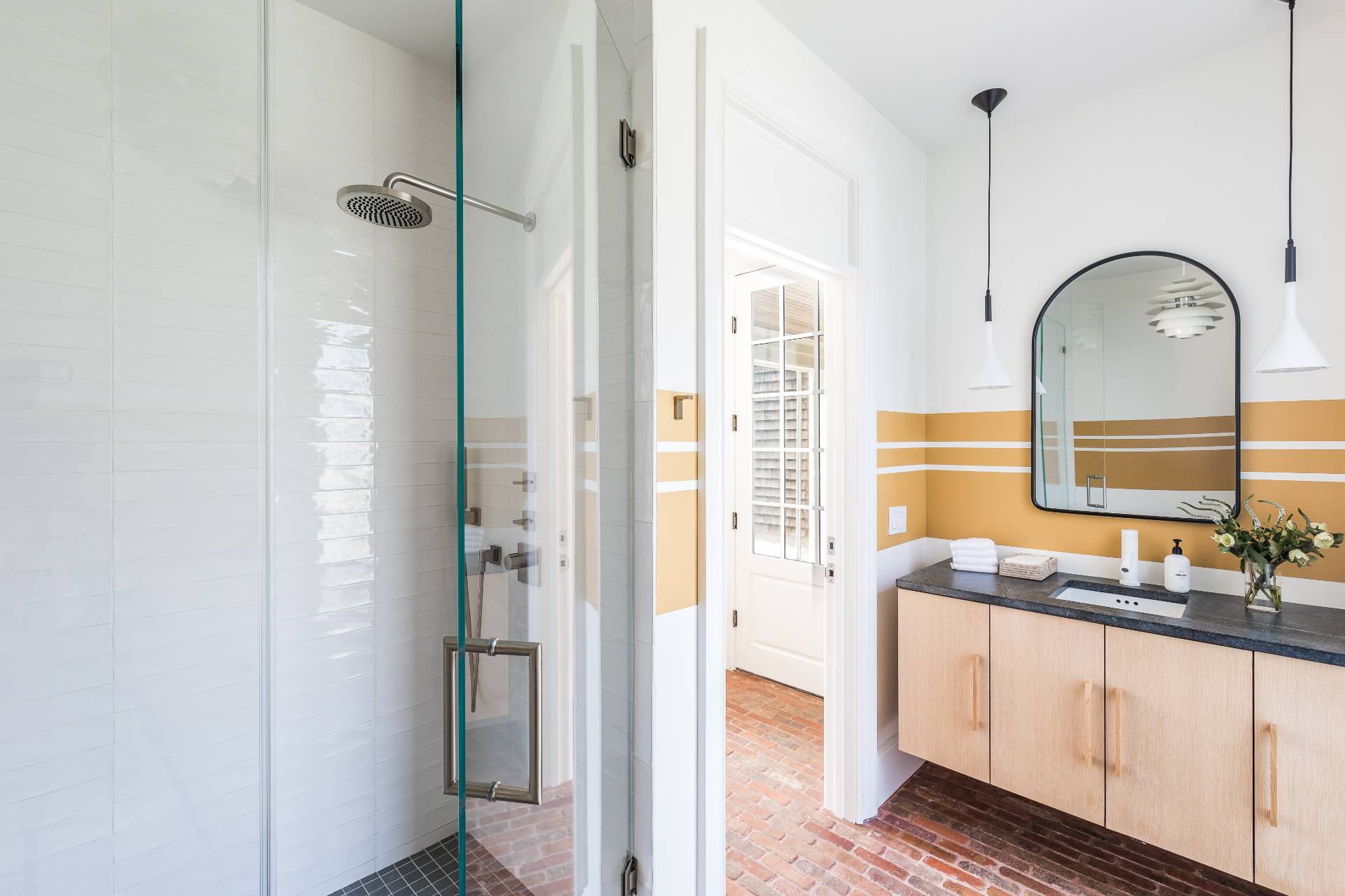 373 Mitchell Lane Bridgehampton, NY 11932 - Photo 27 of 34 a bathroom with a granite countertop sink and a mirror