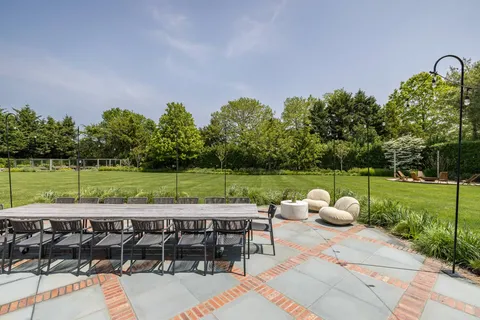 a view of a sitting area with furniture and garden