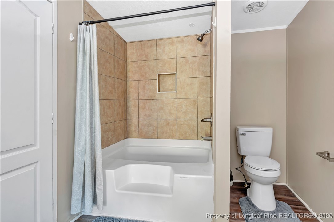 157 Amarilla Road Fairmont, NC 28340 - Photo 13 of 24 a bathroom with a toilet and a shower