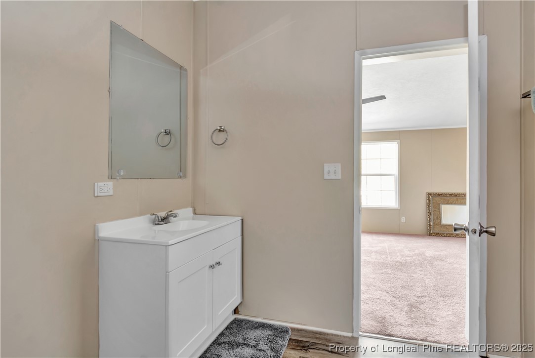 157 Amarilla Road Fairmont, NC 28340 - Photo 14 of 24 a bathroom with a sink toilet and shower