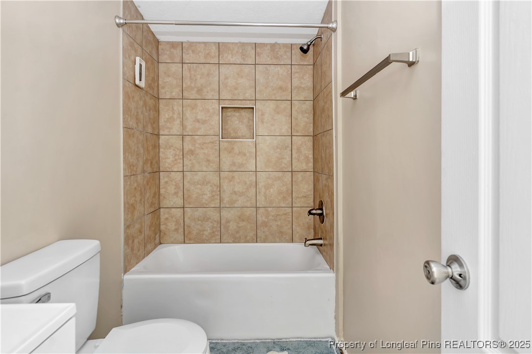 157 Amarilla Road Fairmont, NC 28340 - Photo 19 of 24 a bathroom with a toilet and a bathtub
