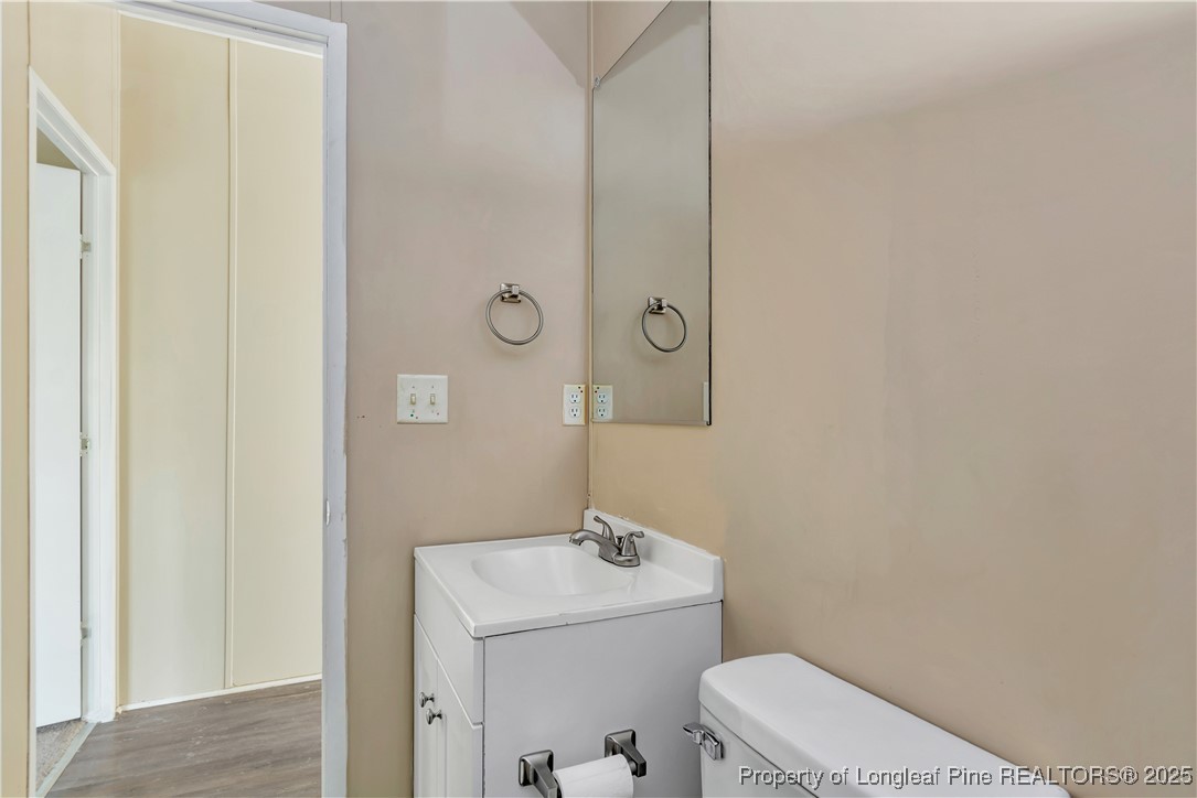 157 Amarilla Road Fairmont, NC 28340 - Photo 20 of 24 a bathroom with a sink a toilet and a mirror