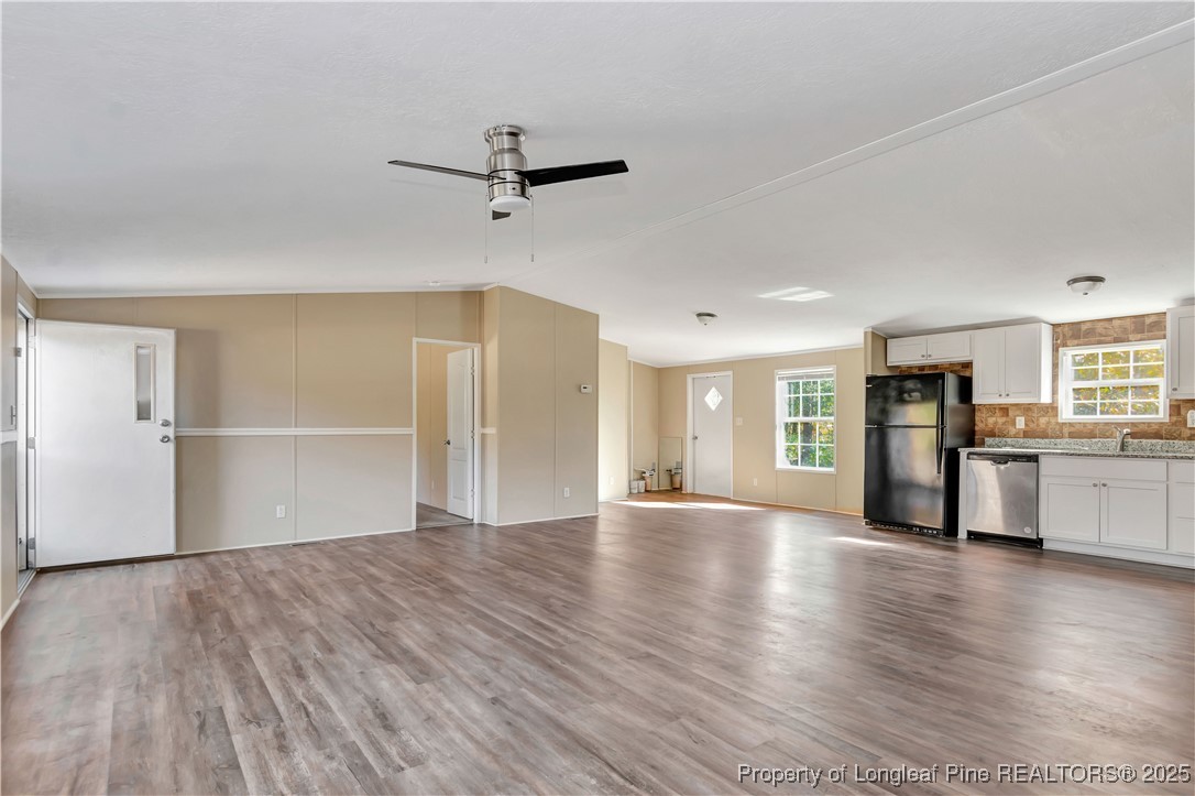 157 Amarilla Road Fairmont, NC 28340 - Photo 7 of 24 a view of an empty room with window and wooden floor