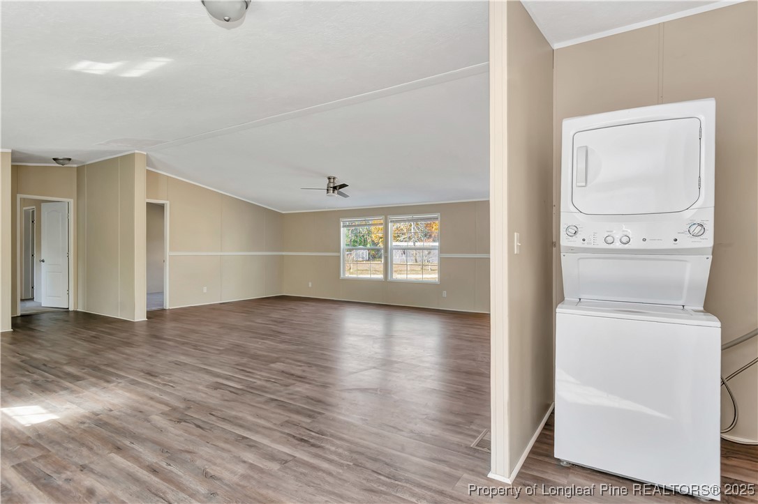 157 Amarilla Road Fairmont, NC 28340 - Photo 10 of 24 a view of empty room with wooden floor and fan