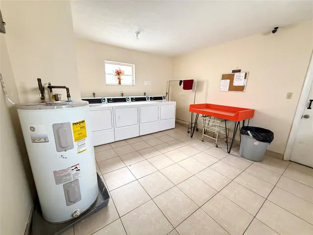 a bed room with a bed and a window