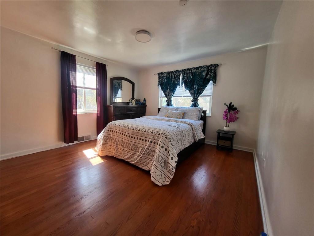 225 Greenlee Road Pittsburgh, PA 15227 - Photo 15 of 24 a bedroom with a bed table and a window