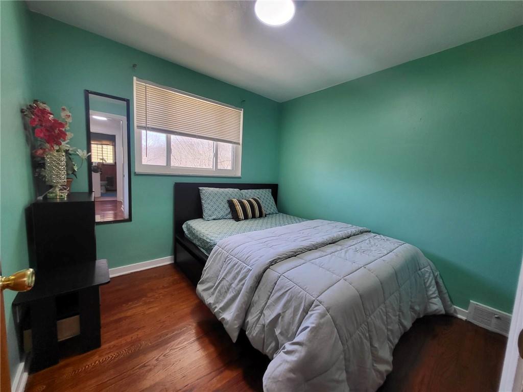 225 Greenlee Road Pittsburgh, PA 15227 - Photo 16 of 24 a bedroom with a bed and window