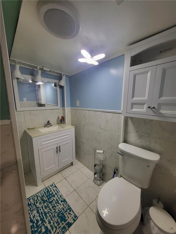 225 Greenlee Road Pittsburgh, PA 15227 - Photo 17 of 24 a bathroom with a granite countertop toilet sink and mirror