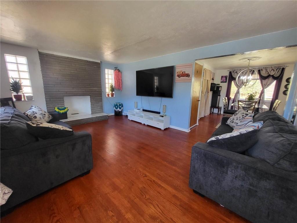 225 Greenlee Road Pittsburgh, PA 15227 - Photo 3 of 24 a living room with furniture and a flat screen tv