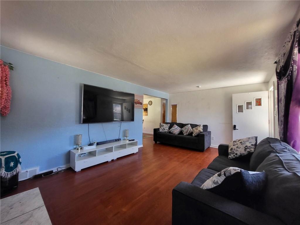 225 Greenlee Road Pittsburgh, PA 15227 - Photo 4 of 24 a living room with furniture and a flat screen tv
