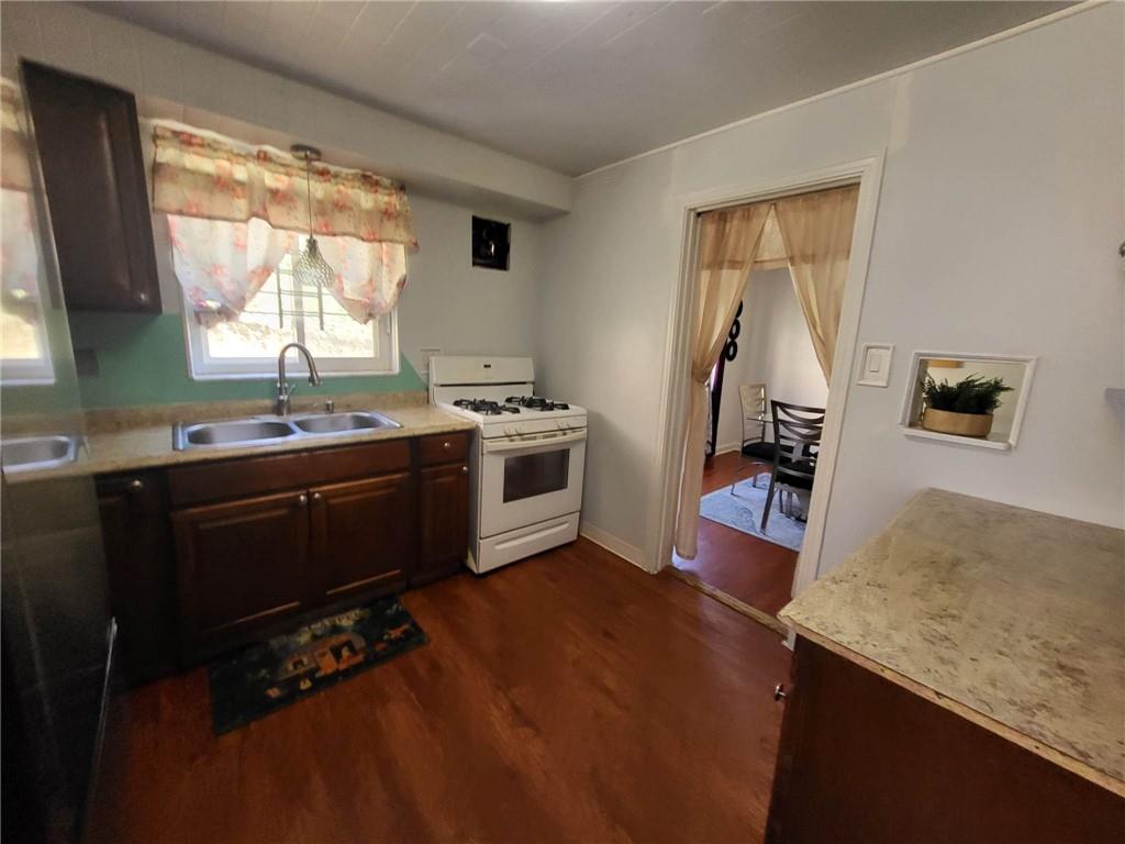 225 Greenlee Road Pittsburgh, PA 15227 - Photo 5 of 24 a kitchen with stainless steel appliances granite countertop a stove a sink and a refrigerator