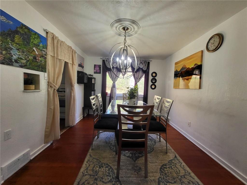 225 Greenlee Road Pittsburgh, PA 15227 - Photo 9 of 24 a dining room with furniture a rug and a window