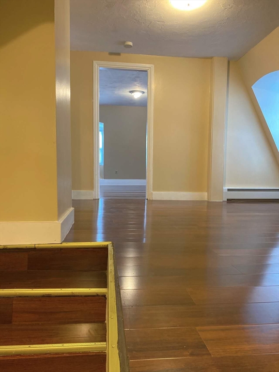 12 Baldwin Street, Unit 1 Newton, MA 02458 - Photo 2 of 7 a view of wooden door