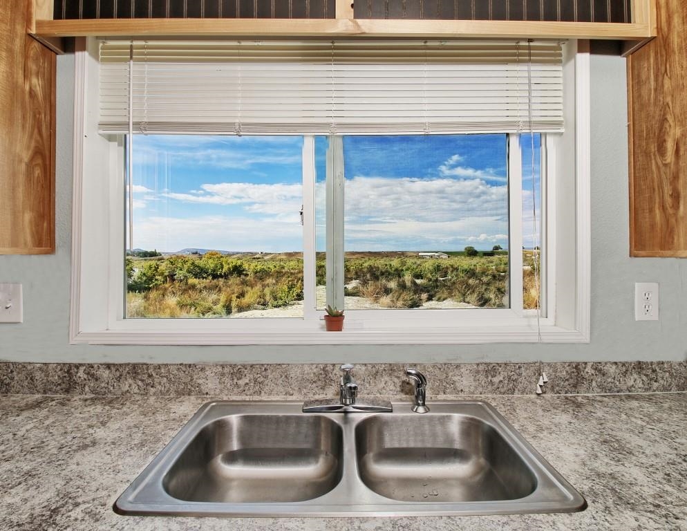 1831 10 Road Mack, CO 81525 - Photo 11 of 27 a kitchen sink sitting next to a window