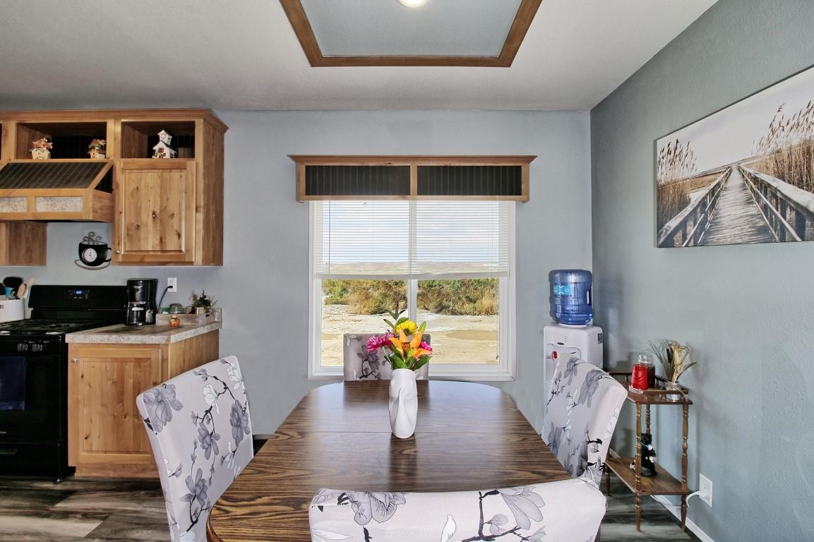 1831 10 Road Mack, CO 81525 - Photo 13 of 27 a living room with furniture dining table and wooden floor