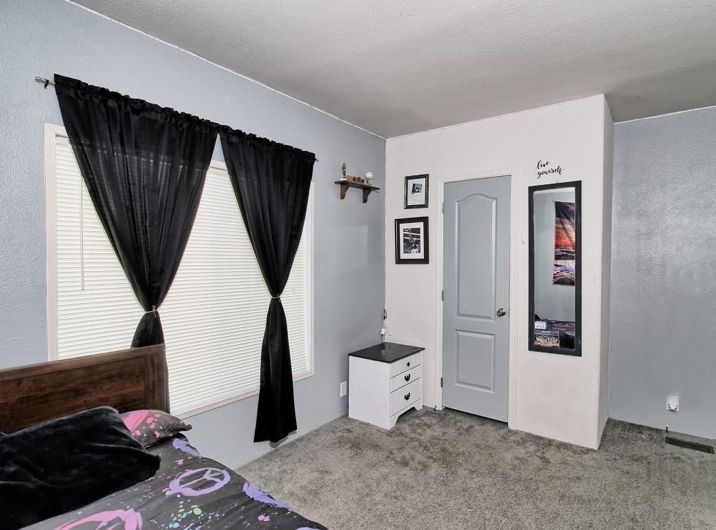 1831 10 Road Mack, CO 81525 - Photo 19 of 27 a living room with closet and a wooden floor