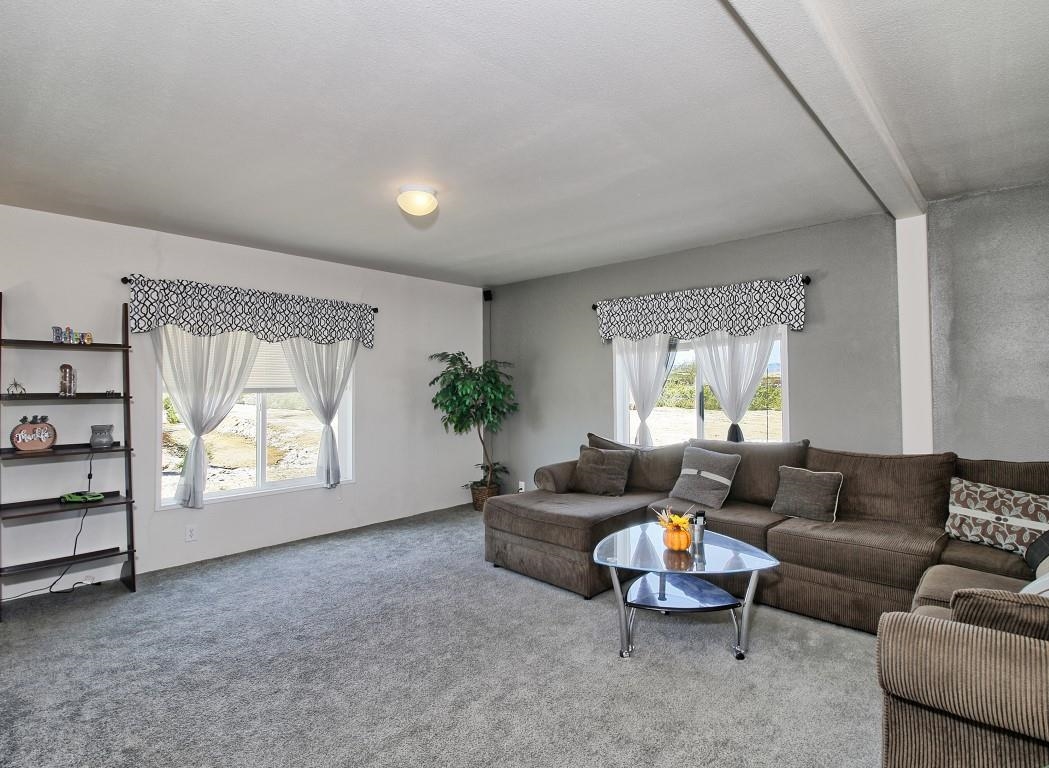 1831 10 Road Mack, CO 81525 - Photo 2 of 27 a living room with furniture and a window