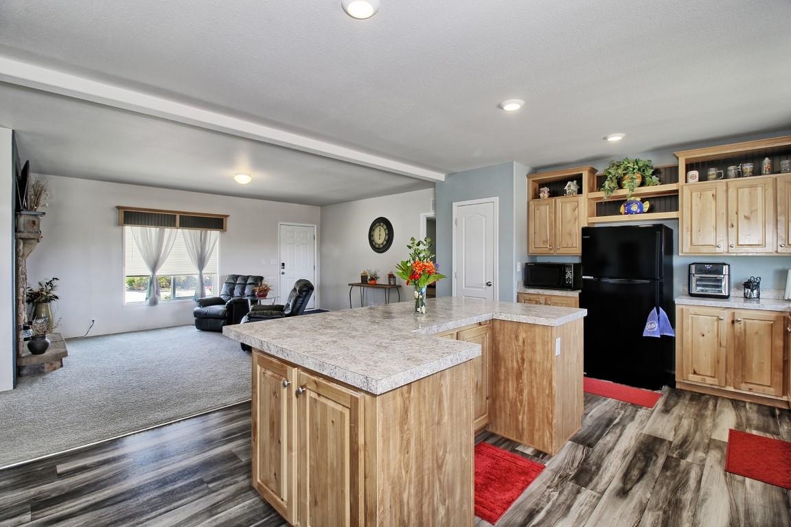 1831 10 Road Mack, CO 81525 - Photo 8 of 27 a living room with furniture and a wooden floor