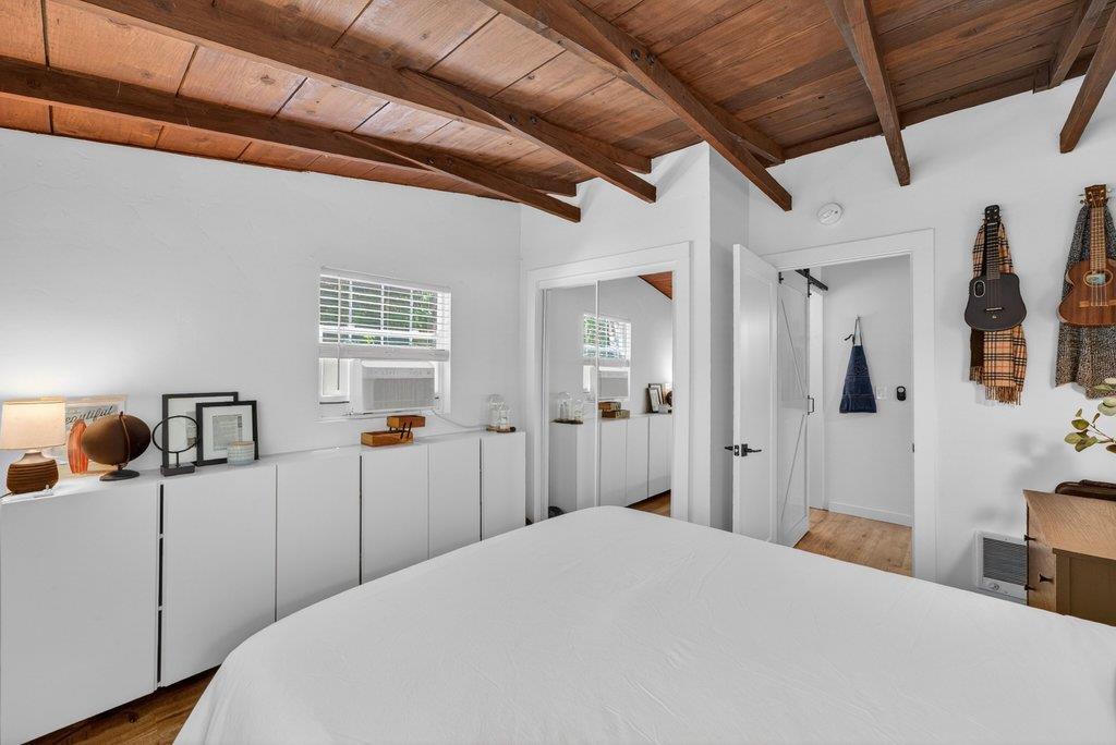 125 Shadowbrook Road Ben Lomond, CA 95005 - Photo 33 of 60 a bedroom with a bed and a large mirror