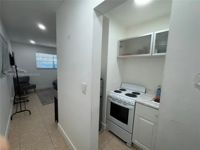 a kitchen with a stove and a microwave