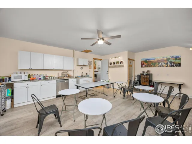 a view of a dinning table and chairs in patio of the house