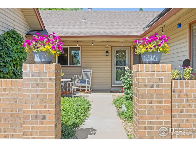 a living room with kitchen island furniture and a kitchen view