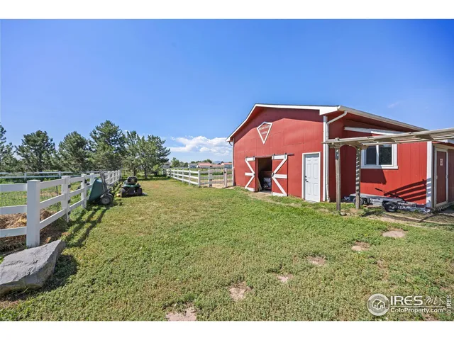 an aerial view of a house with yard swimming pool and outdoor seating