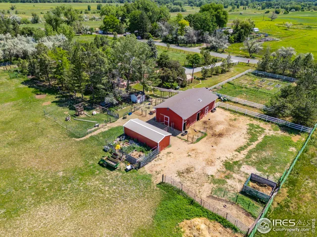 a view of a house with backyard sitting area and garden