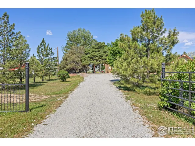 an aerial view of a house with a mountain in the background