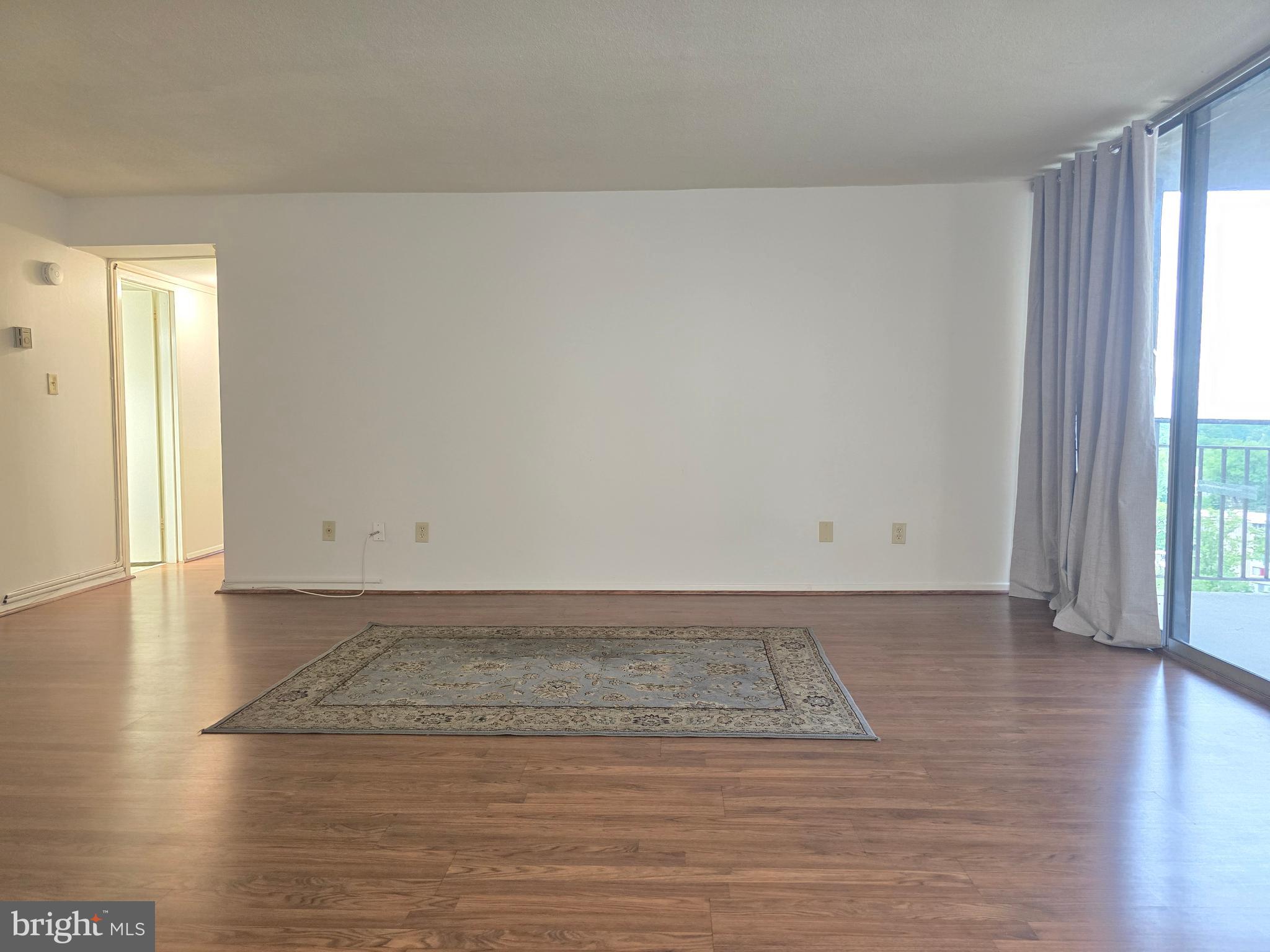 1836 Metzerott Road, Unit 1524 Hyattsville, MD 20783 - Photo 15 of 22 a view of a room with wooden floor and window