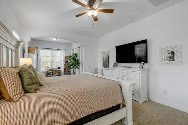 a bathroom with a granite countertop sink a mirror and shower