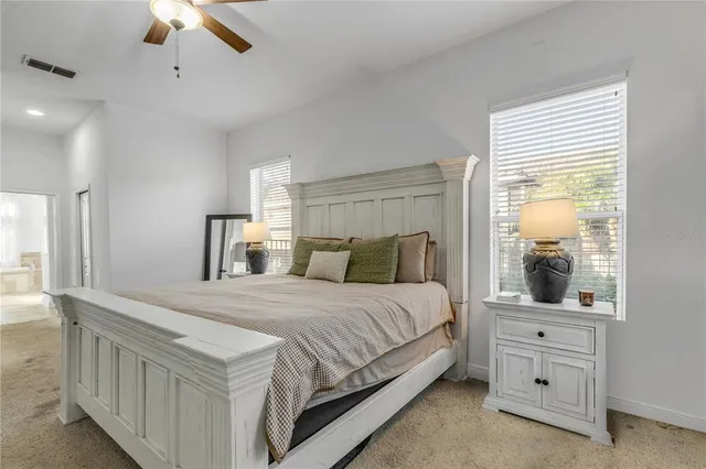 a living room with fireplace furniture and a large window