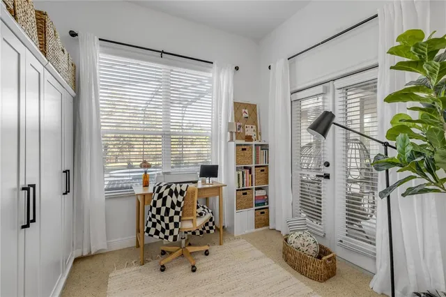 a dining room with stainless steel appliances kitchen island granite countertop a dining table and chairs