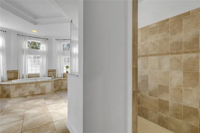 a kitchen with kitchen island granite countertop a sink stove and refrigerator