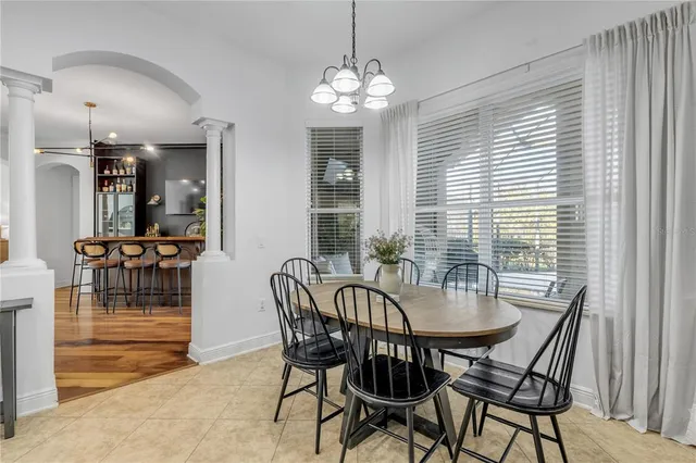 a view of a livingroom with workspace and a window