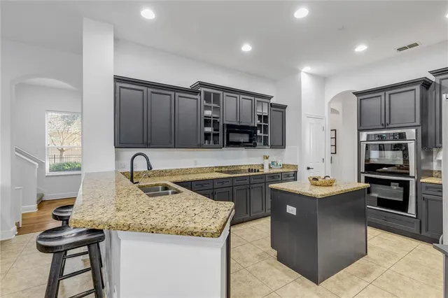 a room with gym equipment and view of living room