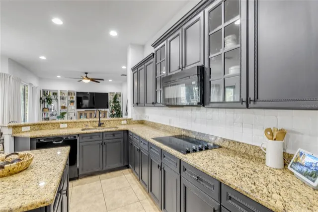 a bedroom with a bed and a ceiling fan