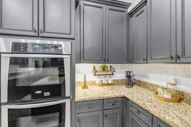an aerial view of a house with a yard swimming pool and outdoor seating