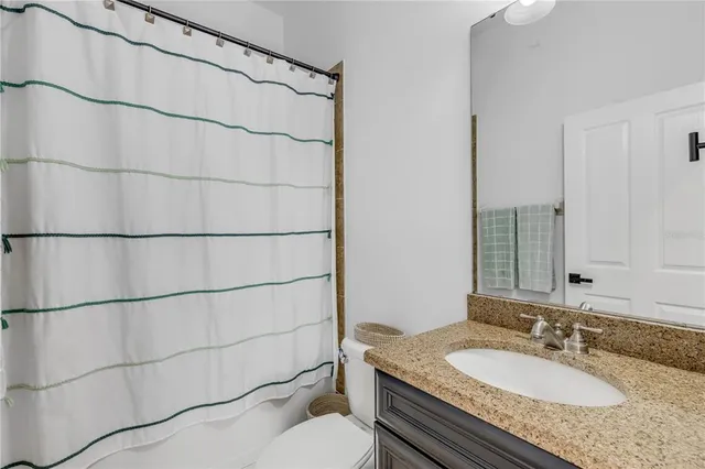 a bed room with a bed and a desk