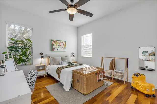 a bedroom with bed and a window